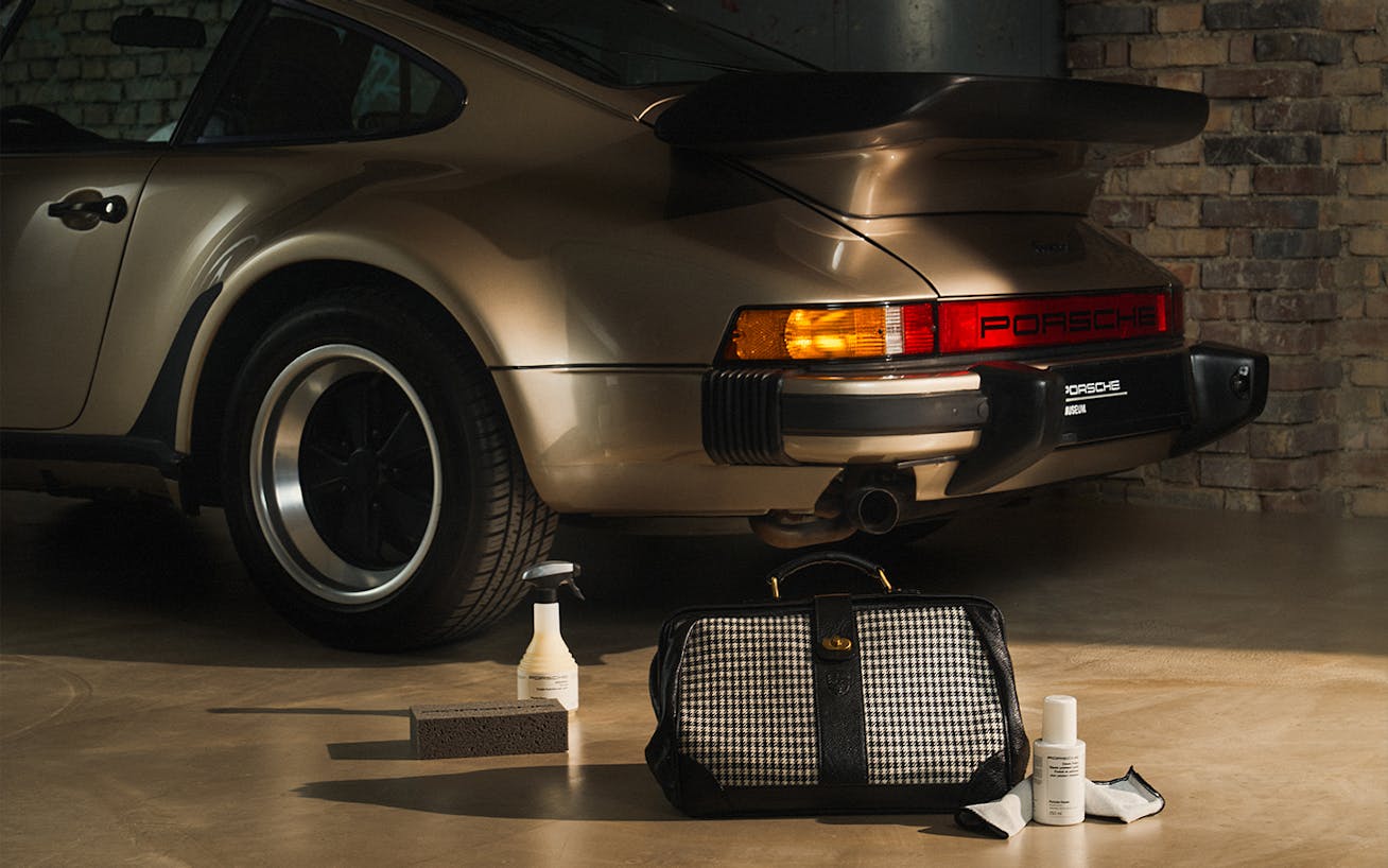 Porsche Classic care set displayed beside classic Porsche 930 Turbo 