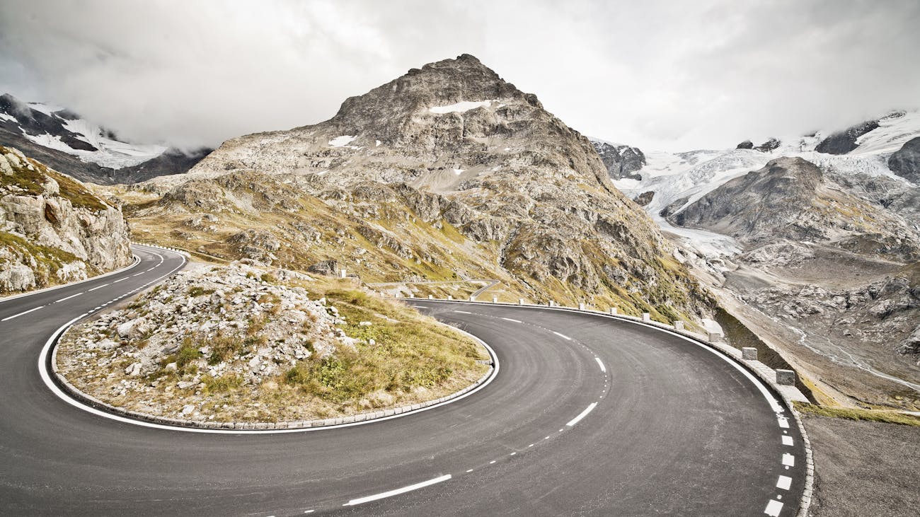 Empty, curvy road in the Swiss Alps