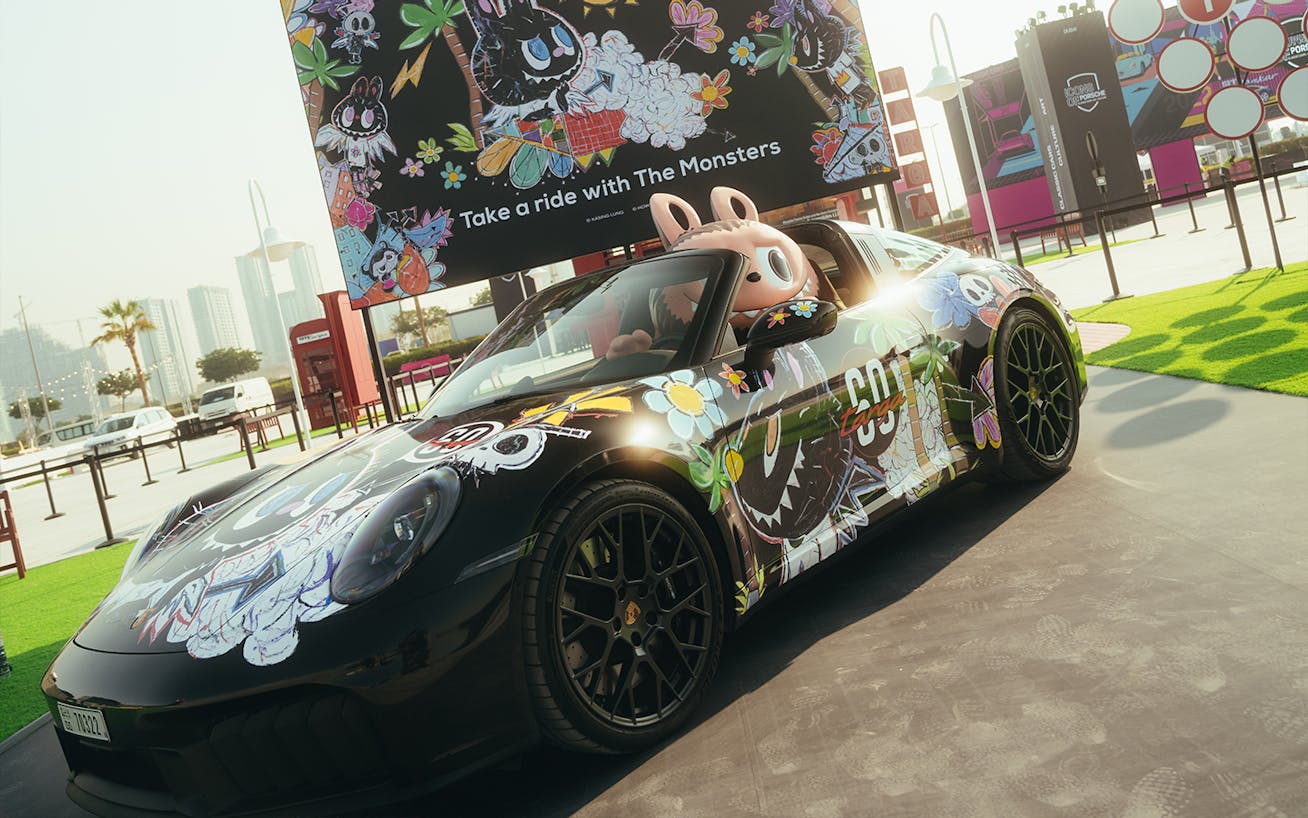The Monsters character, King Mon, in Porsche 911 Targa installation at the 2025 Icons of Porsche in Dubai 