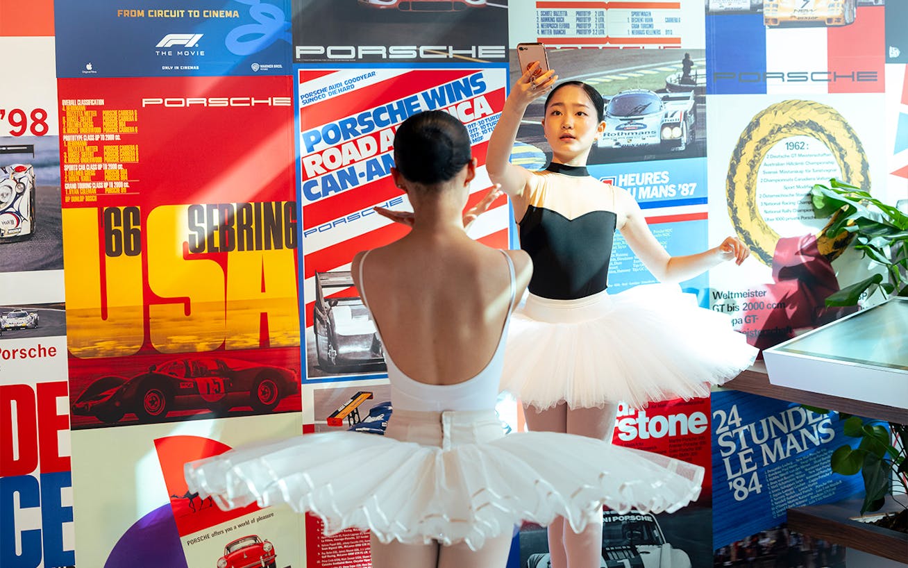 Ballet dancers pose in Porsche Brand Store