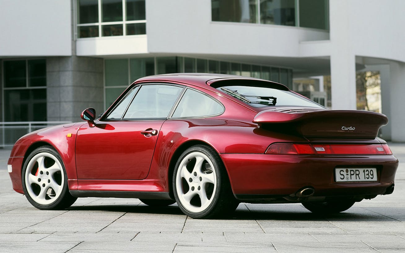 Porsche 911 Turbo (type 993) parked outside Bauhaus-style building