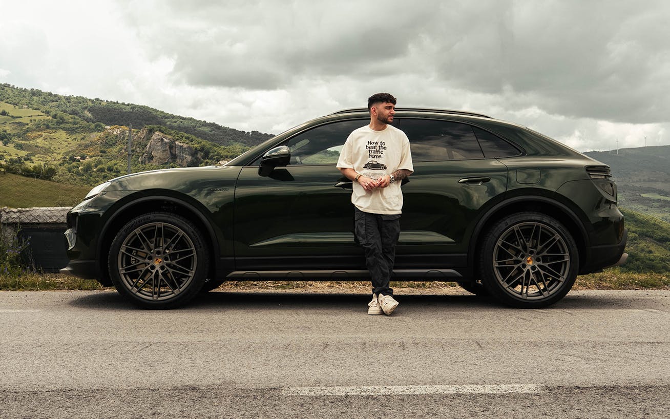 YouTuber Andres Vidoza in front of Porsche Macan 4S Electric