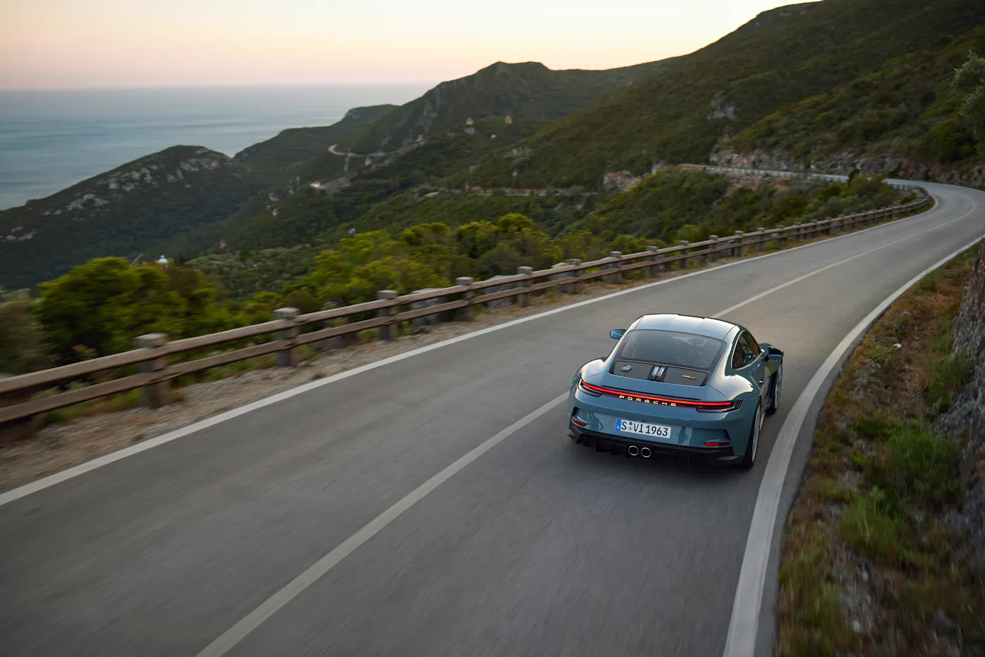 Porsche 911 S/T — rear view — coastal road — official press photography