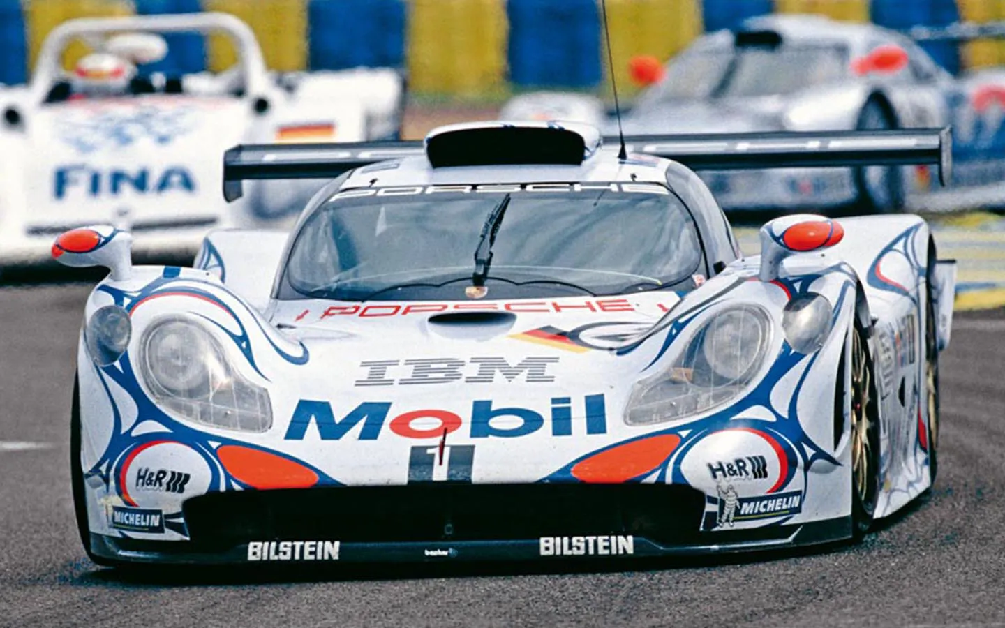 Porsche 911 GT1-98 Le Mans winner 1998 drivers Laurent Aiello, Allan McNish and Stéphane Ortelli driving on circuit