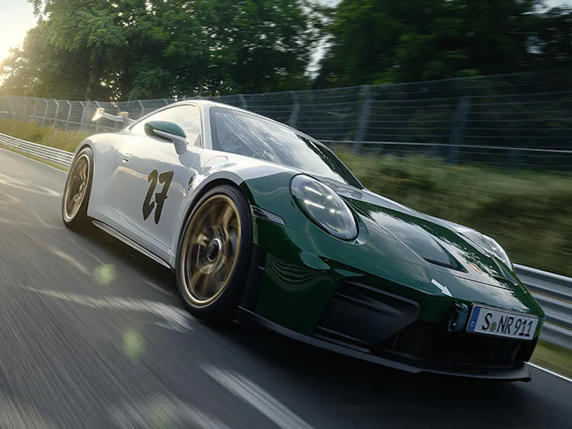 Front three-quarter view of Porsche 911 GT3 100 Jahre Nürburgring driving on Nordschleife hero thumbnail
