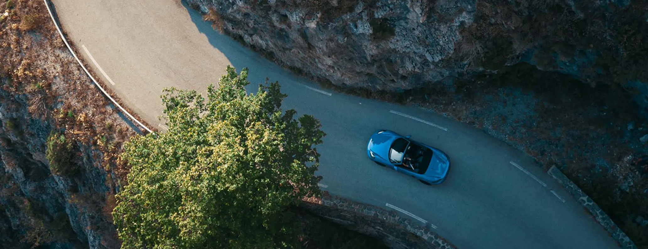 Porsche Boxster 4.0 GTS overhead view driving hero desktop