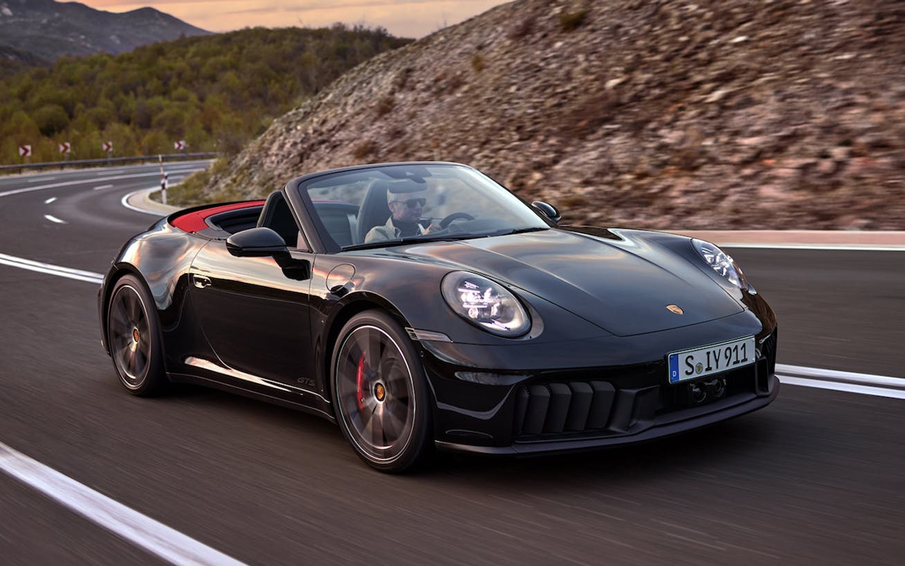 Porsche 911 Carrera GTS Cabriolet cornering with roof down