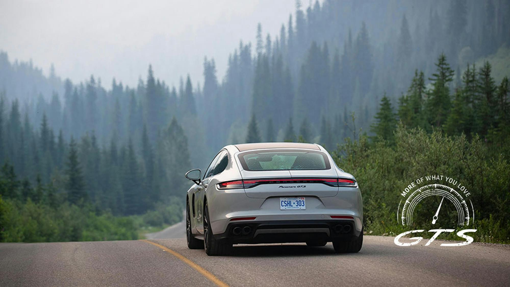 Porsche Taycan GTS saloon driving on tree-lined Canadian road