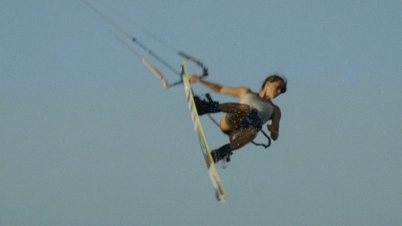 Pro kitesurfer and Porsche athlete Rita Arnaus jumping into sky