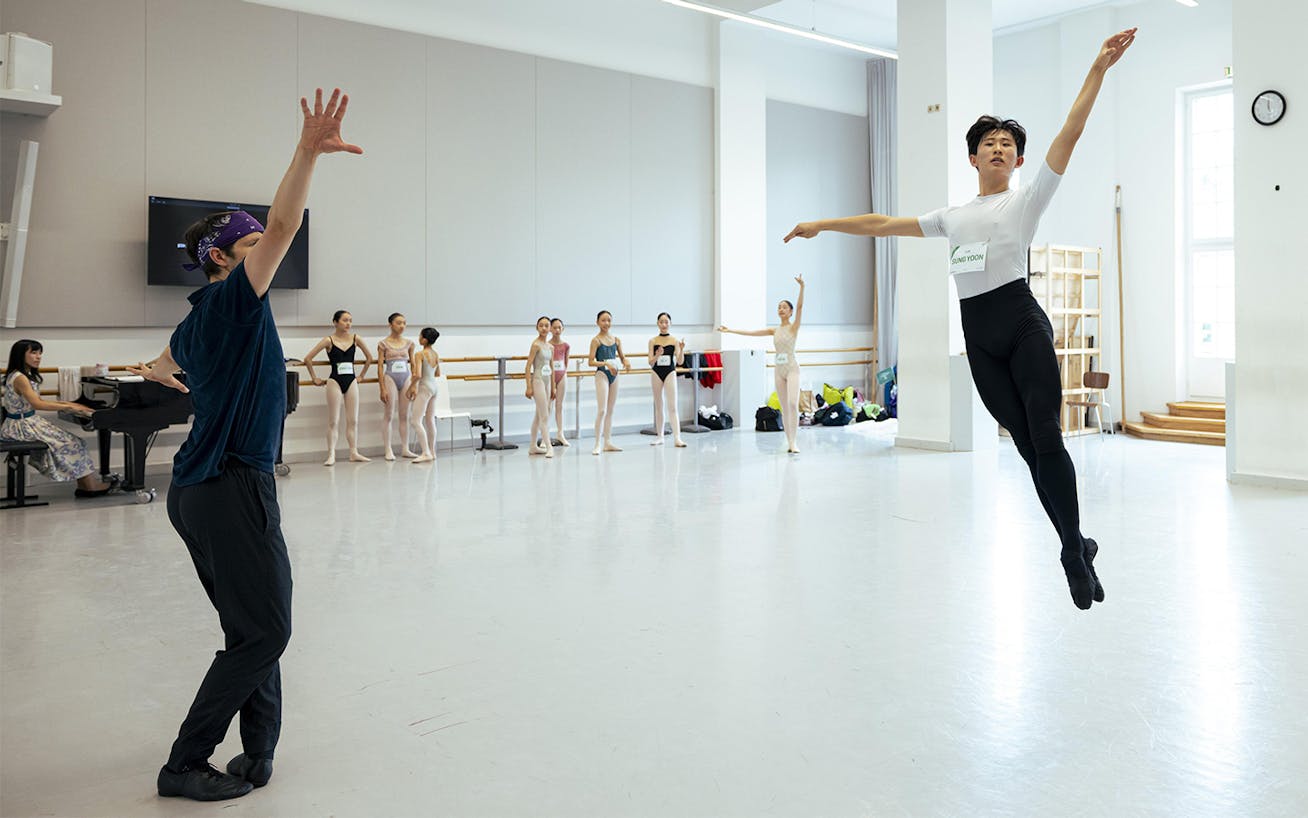 Male ballet dancer pirouettes in dance studio