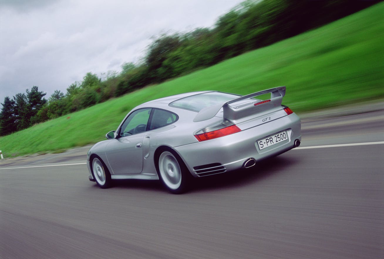 Rear view of Porsche 911 GT2 (type 996) driving on road