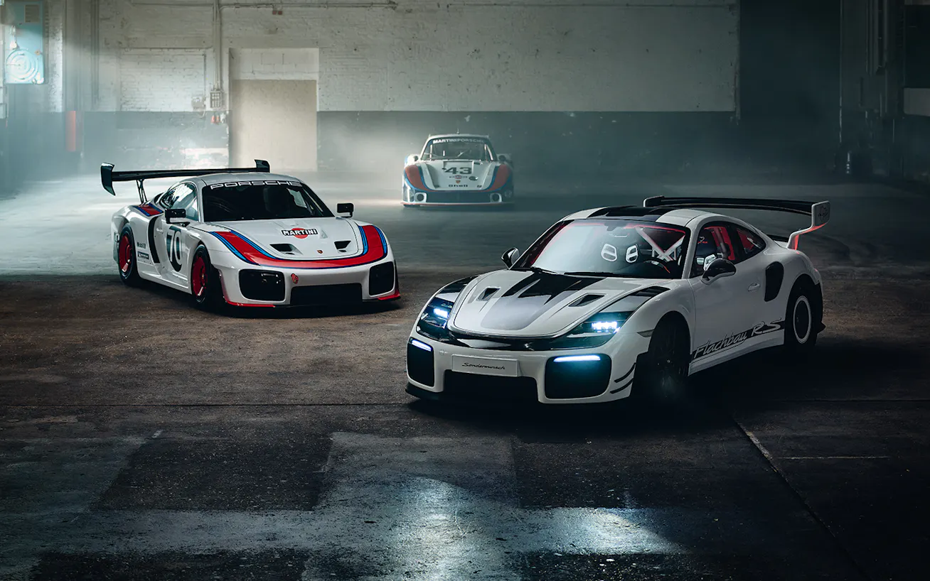 Trio of Porsche 911 Flachbau RS cars shot in dark industrial studio