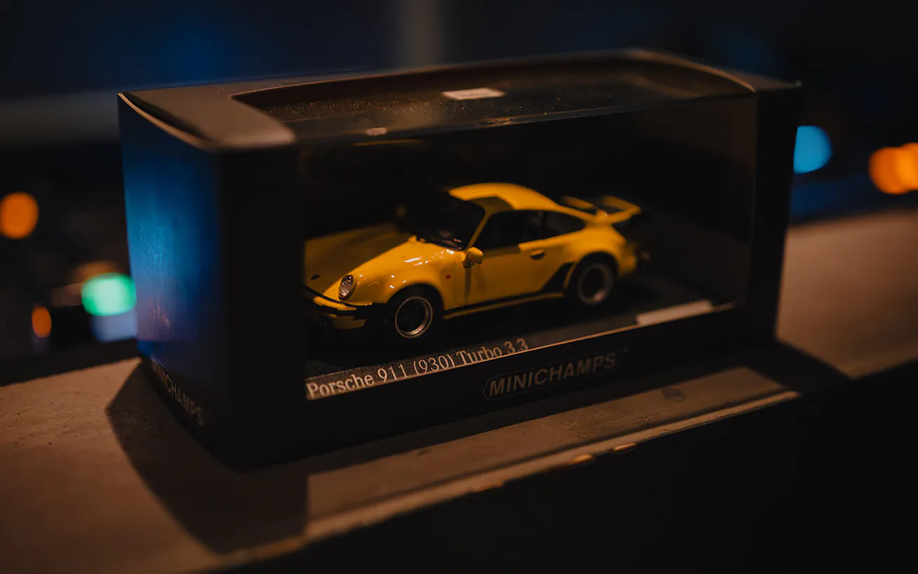 Yellow Porsche 911 Turbo toy car in box