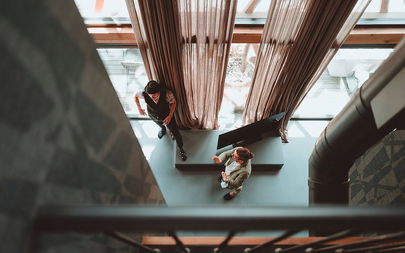 Looking down to where two men are standing and talking