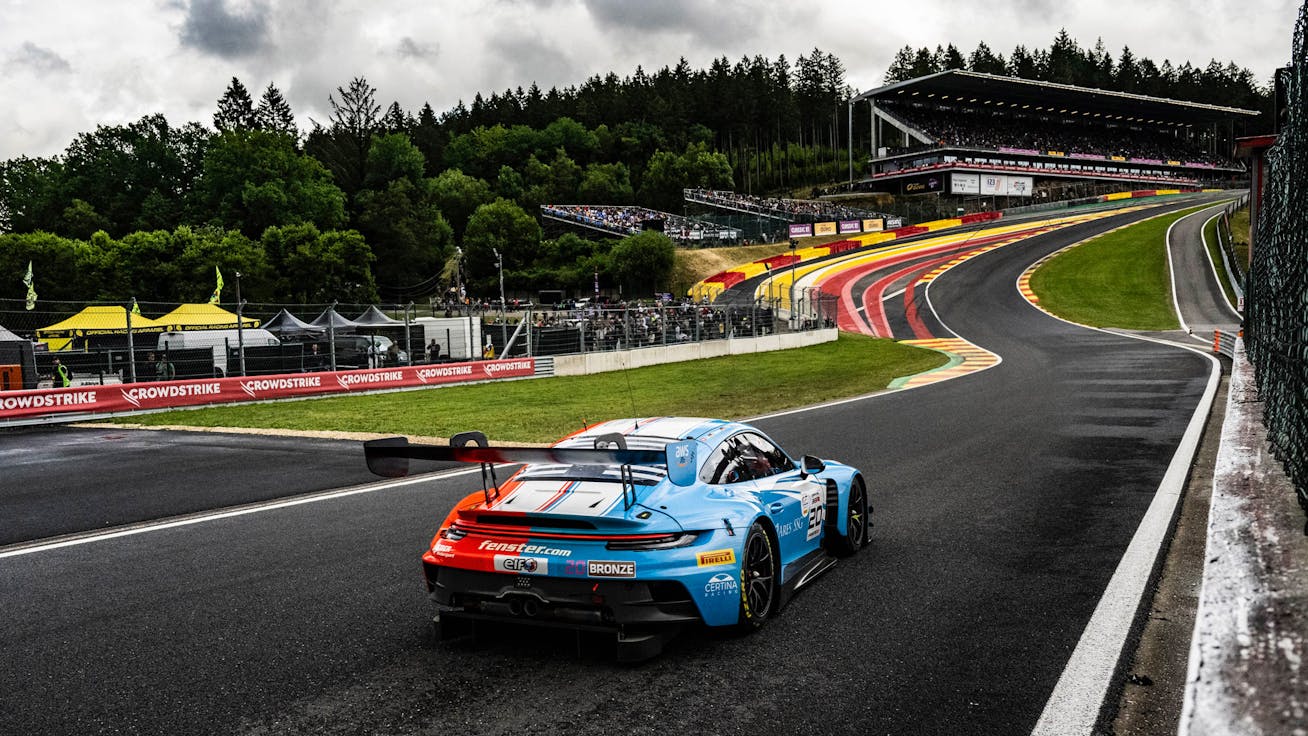 A Porsche race car on the Spa-Francorchamps track