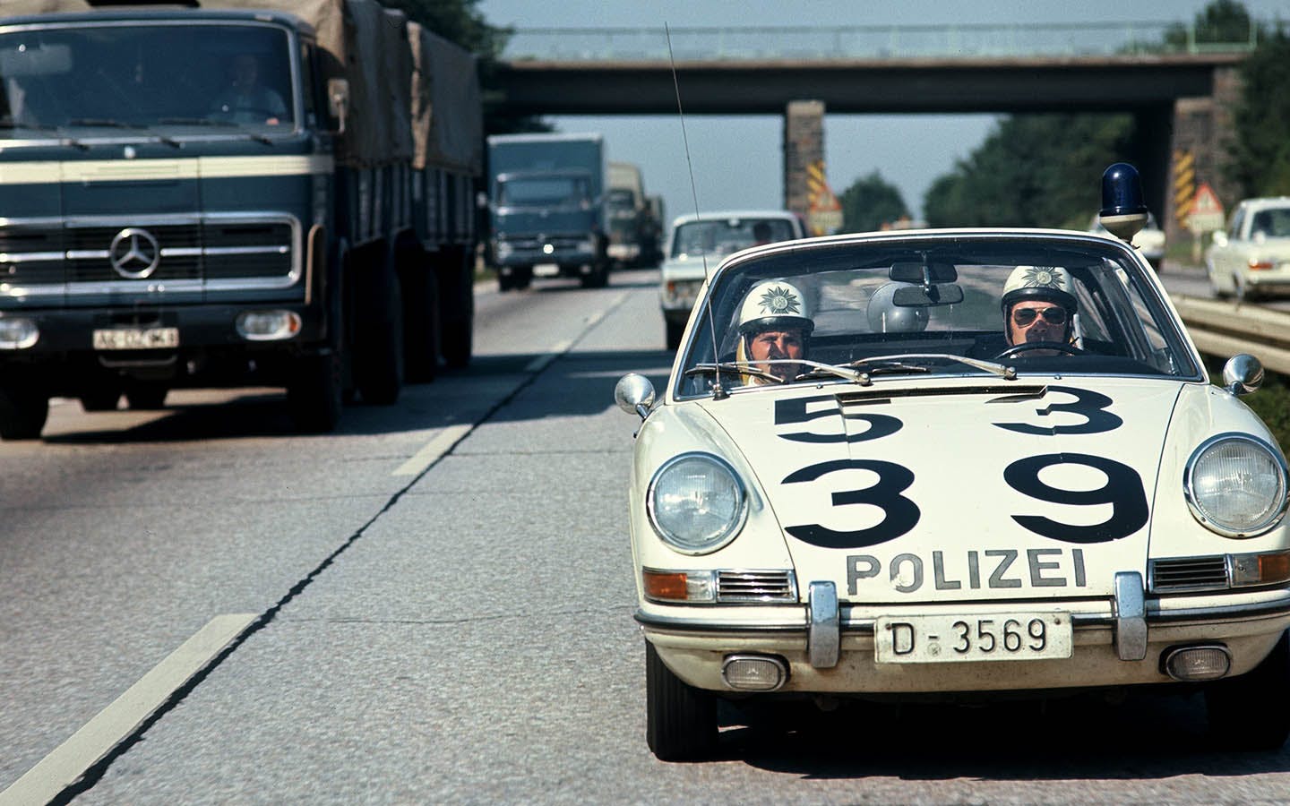 Front view of Porsche 911 police car driving on German Autobahn