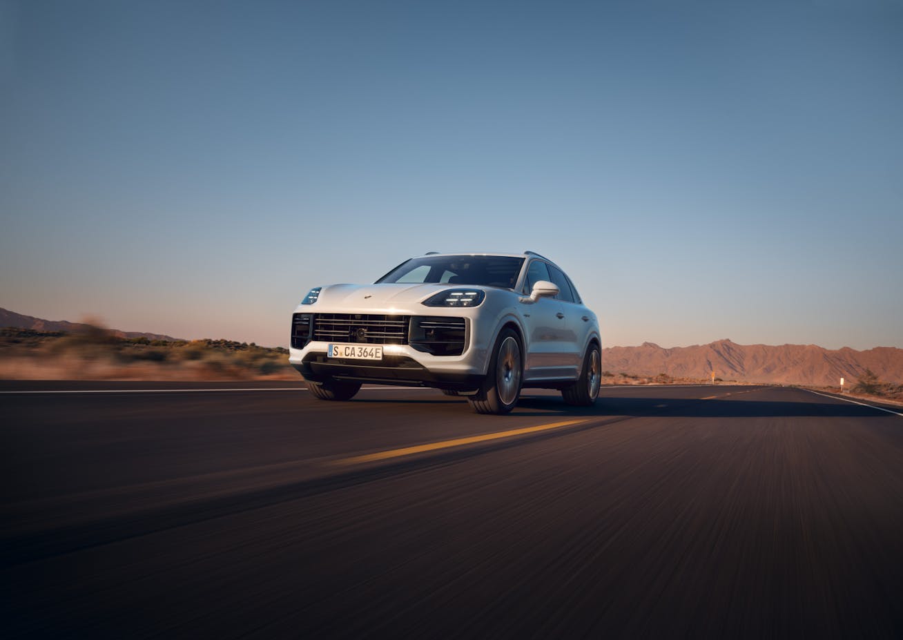 Front view of Porsche Cayenne Turbo E-Hybrid Coupé driving on open road