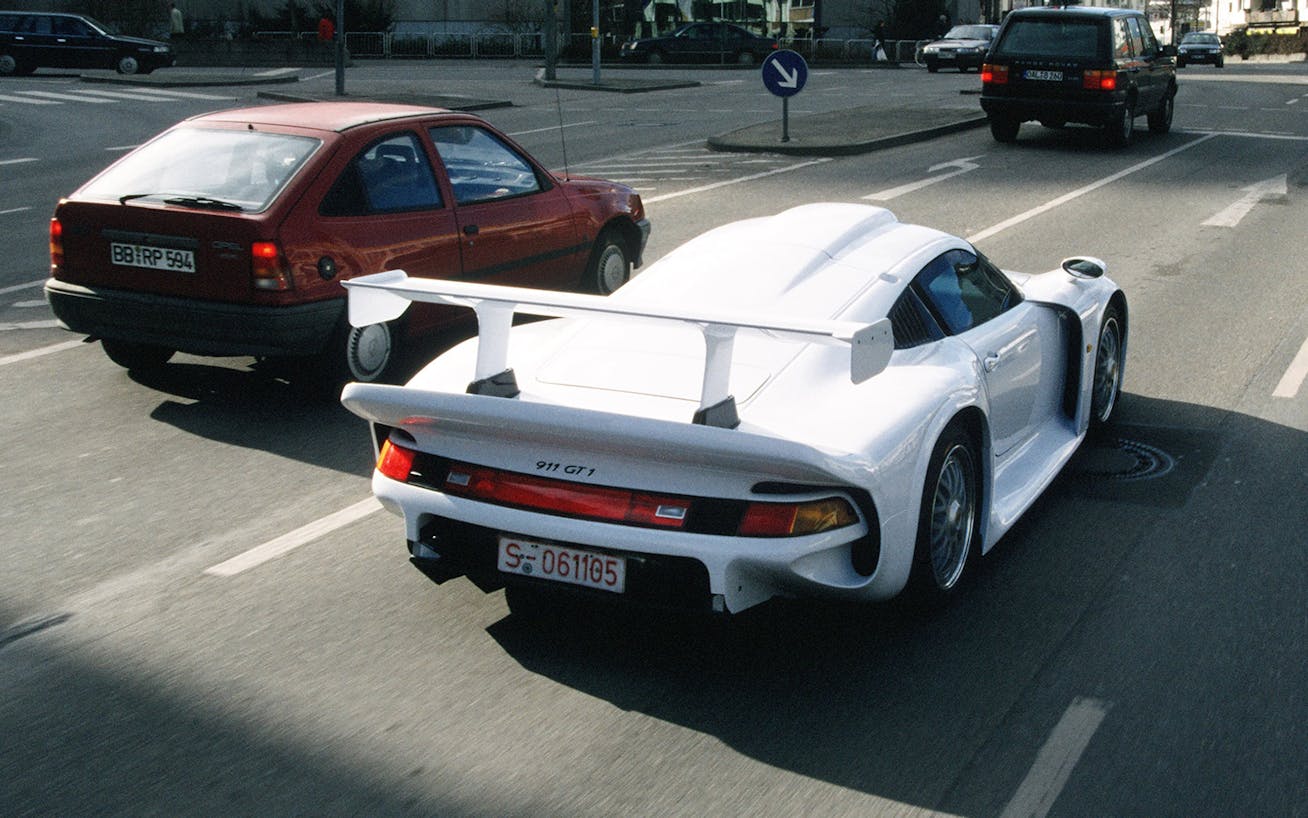 Porsche 911 GT1 Strassenversion driving on German city street