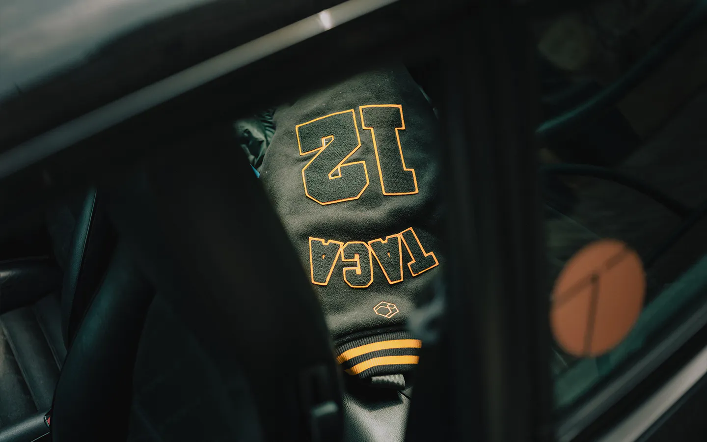 Stitched jacket in backseat of Porsche 911 Carrera S/C