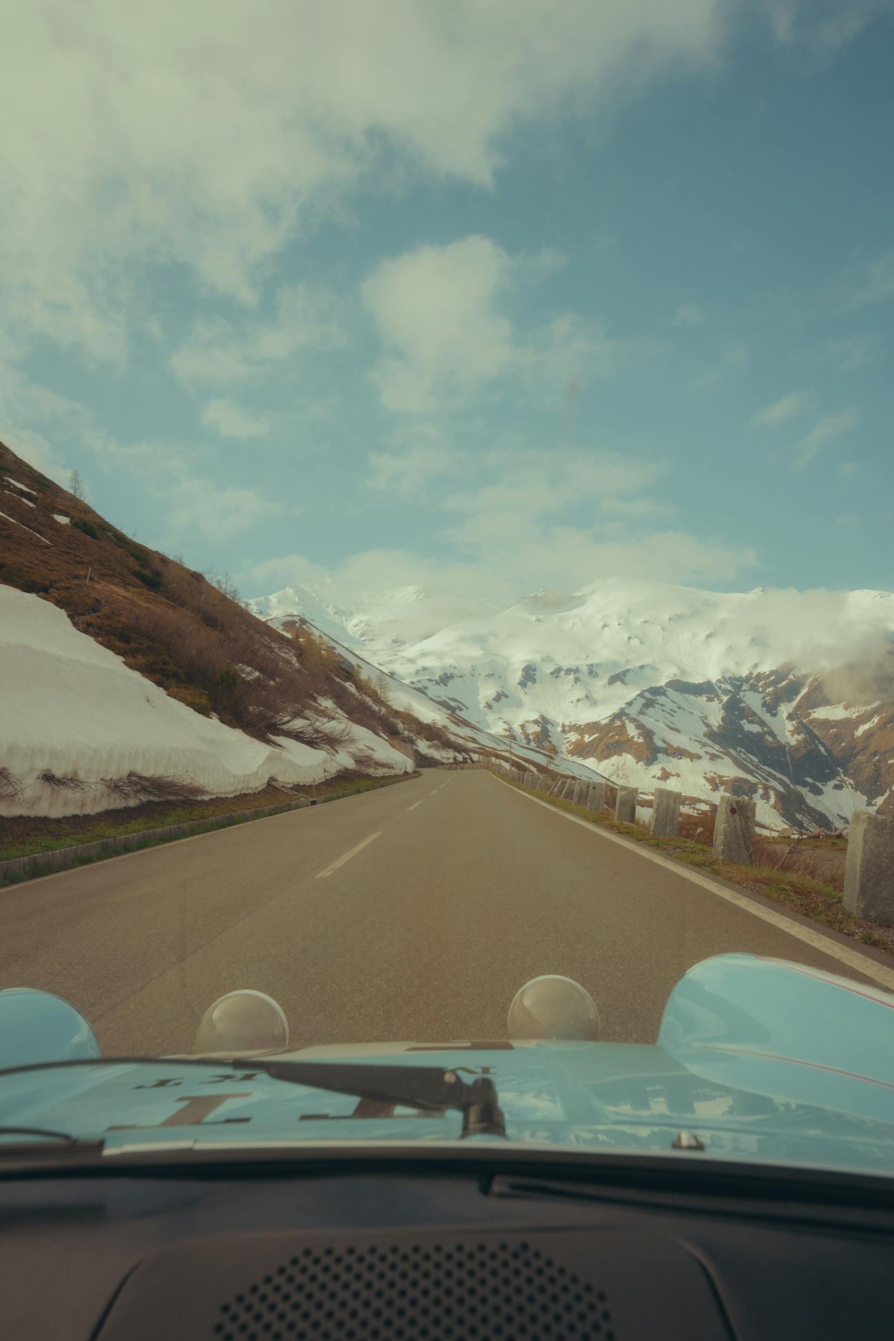 View out of Porsche 911 onto road of Grossglockner Pass, Austria