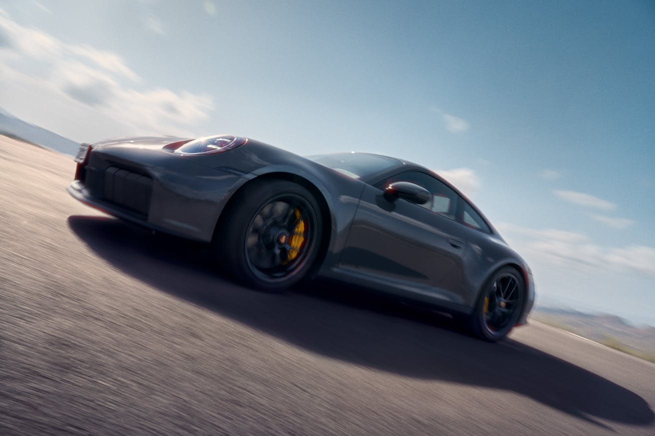 New Porsche 911 driving on the road