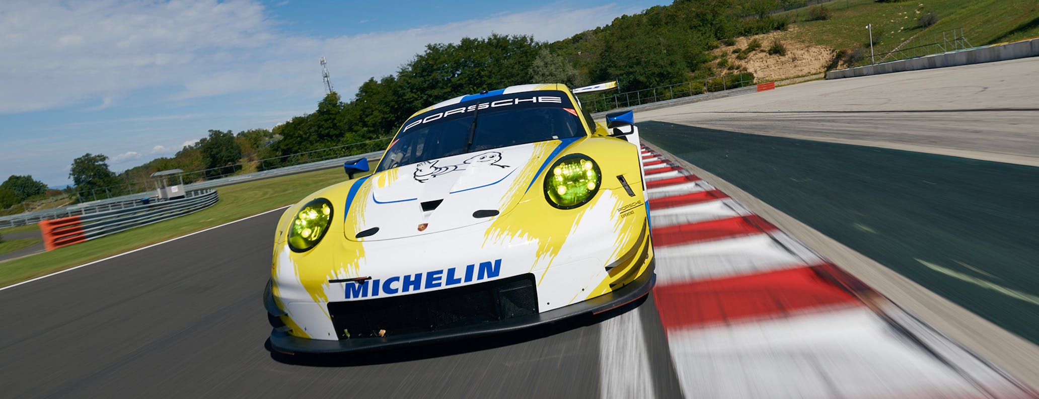 Porsche Track Experience 911 RSR racecar on racetrack  