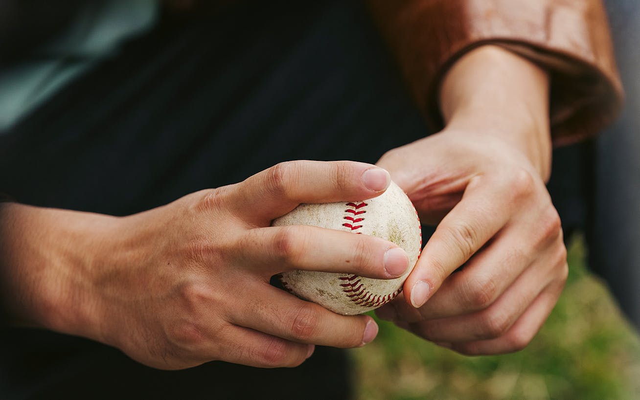 Close-up of hands of Shohei Ohtani with baseball