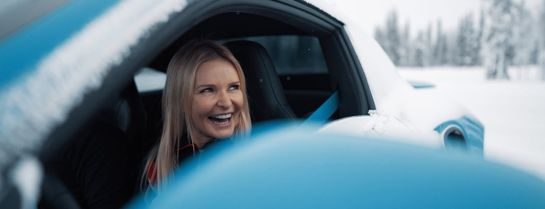 Woman looks out of window of Porsche 911 Turbo S 