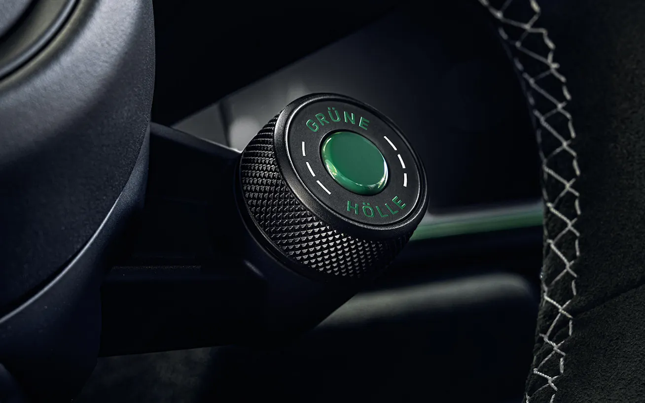 Green mode switch on Porsche 911 GT3 100 Jahre Nürburgring steering wheel with words Grüne Hölle on it