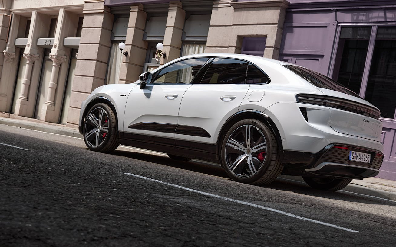 Porsche Macan Turbo Electric in white parked on urban street