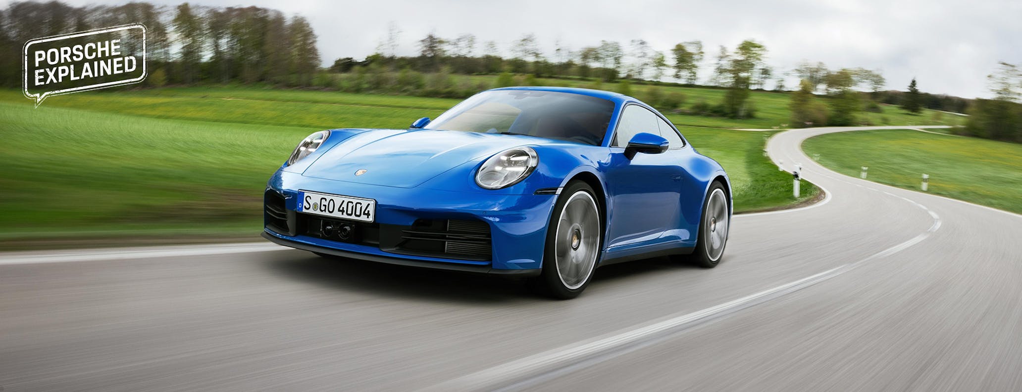 Porsche 911 Carrera in Lugano Blue on twisting German road