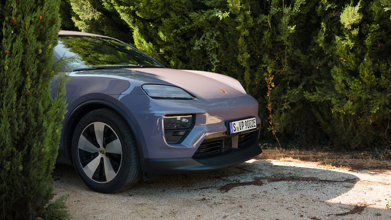 Porsche Macan 4 Electric poking out from trees