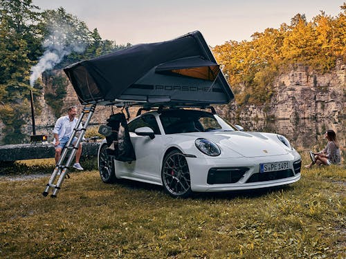 A Porsche with a roof tent in a beautiful landscape