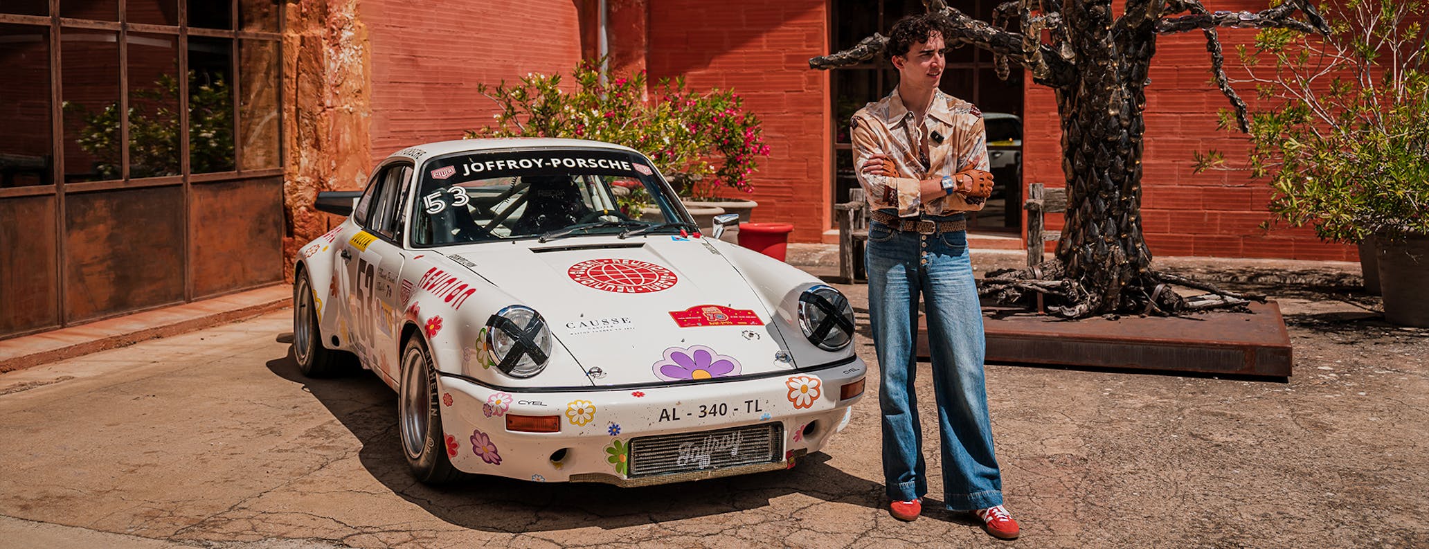 Man with flower power Porsche 911 art car 