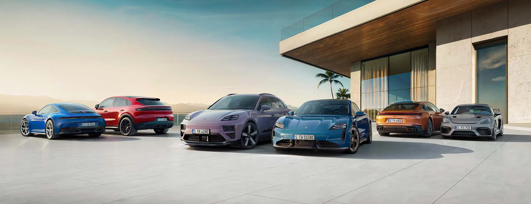 Porsche model range pictured outside modern house