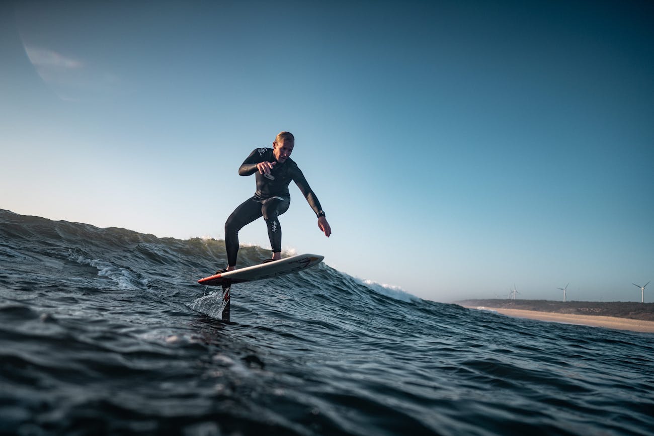 Surfer Andrew Cotton on a foilboard in the ocean