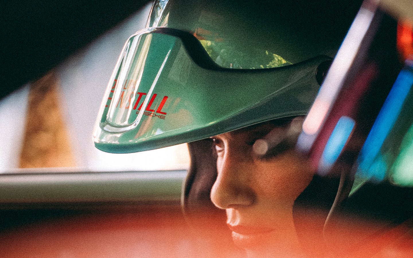 Dua Lipa, wearing race helmet, sat in with Dua Lipa Rennstall Porsche 911 GT3 RS at Goodwood Festival of Speed