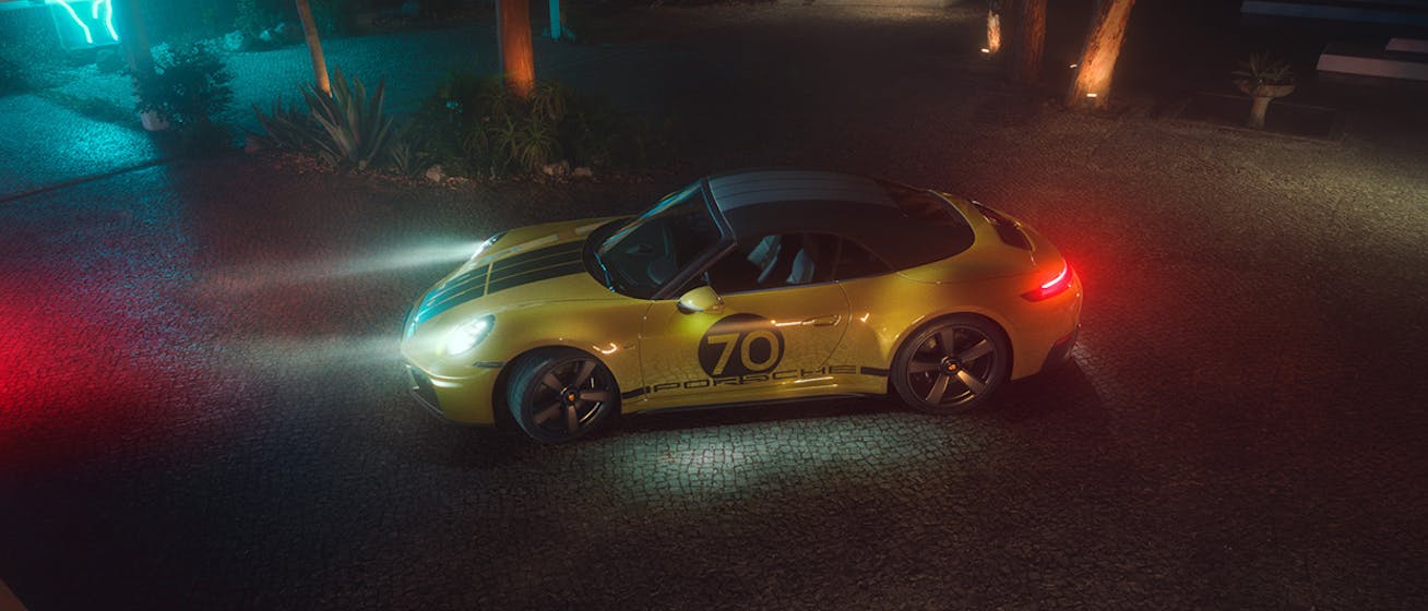 Porsche 911 Spirit 70 at night, headlights on
