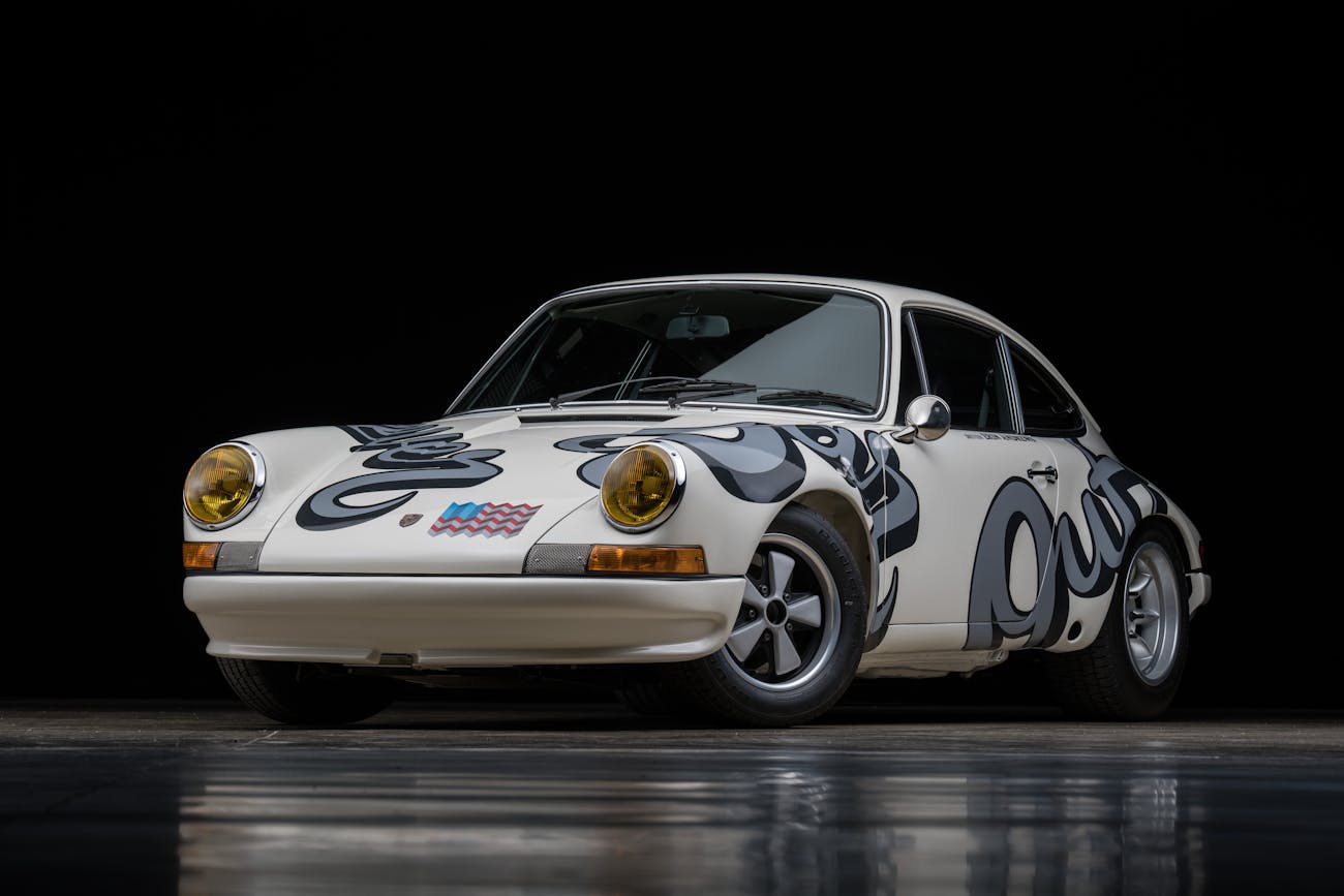 White, typography-covered 911 against a black background