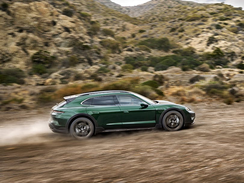 Porsche Taycan Turbo Cross Turismo driving on dirt road