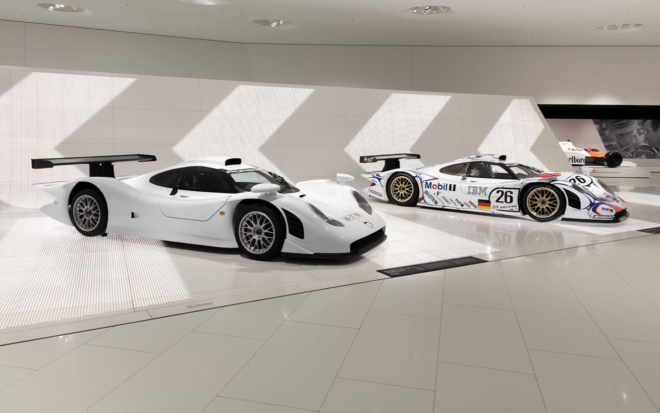 Porsche 911 GT1 Strassenversion alongside GT1-98 race car, Porsche Museum