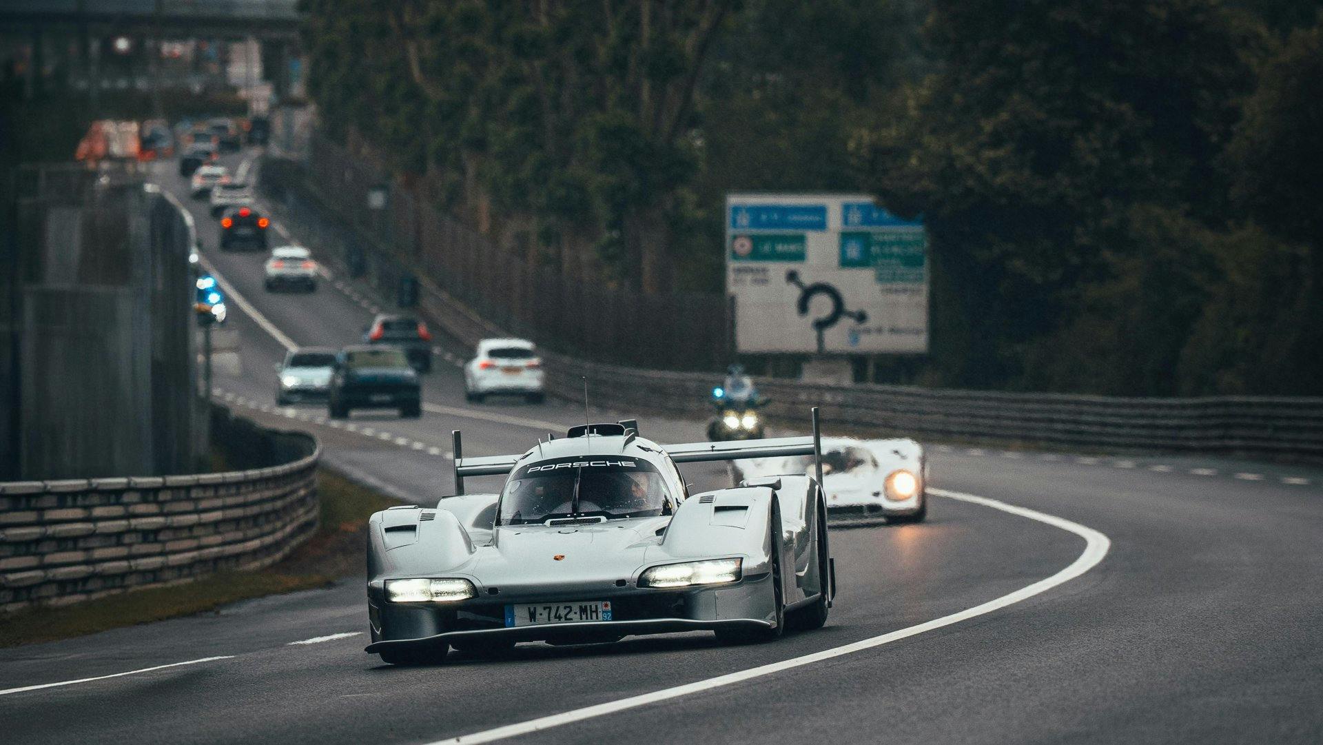Side view of Porsche 963 RSP driving on road