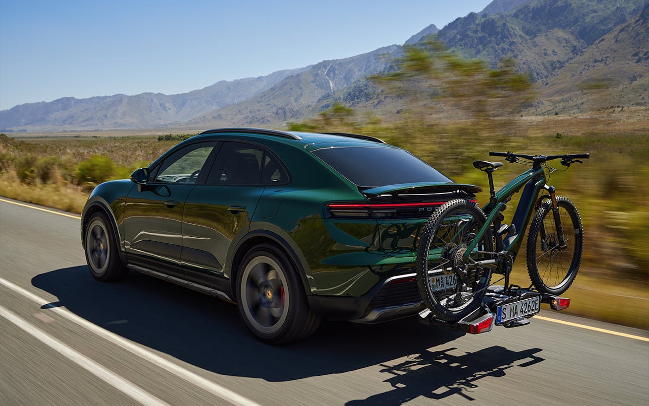 Porsche eBike mounted onto the back of a Porsche Cayenne 