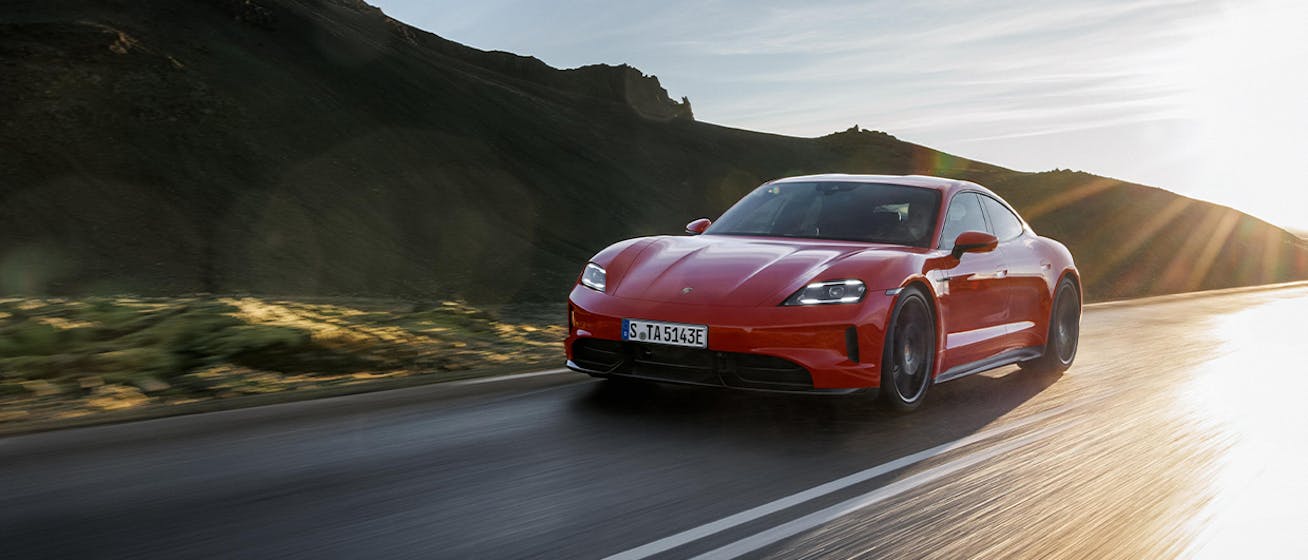 Porsche Taycan GTS driving in volcanic scenery