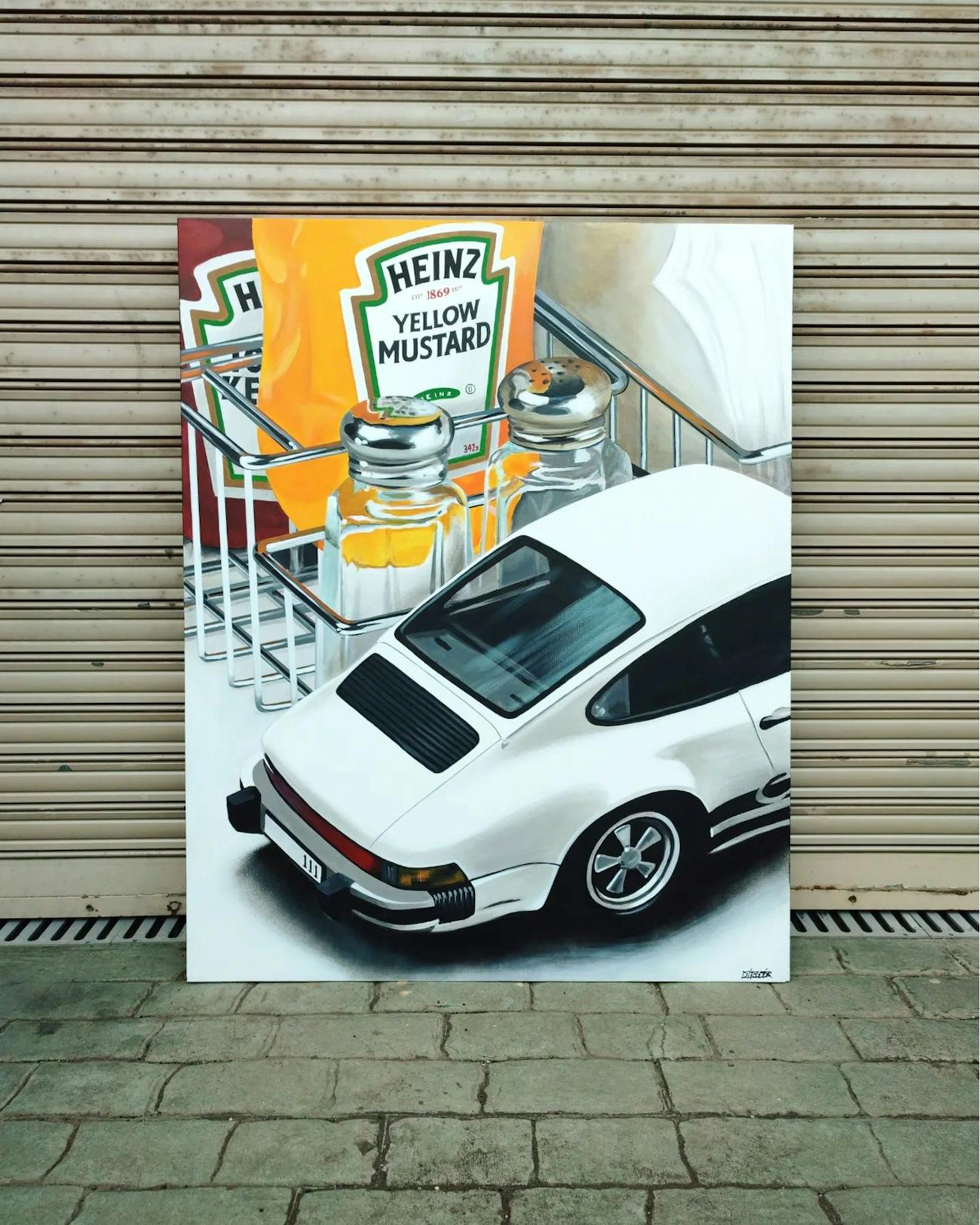Painting of white Porsche 911 next to Heinz mustard and ketchup bottles