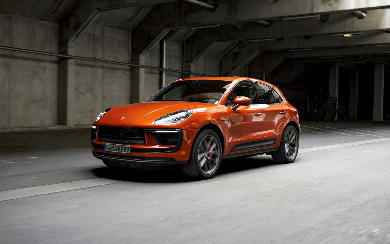 Porsche Macan S driving in Brutalist-style setting