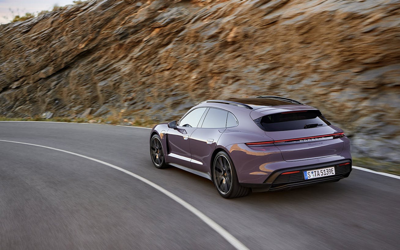 Porsche Taycan 4S Sport Turismo driving through a corner