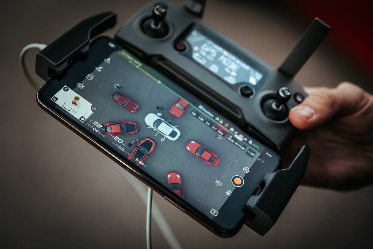 Camera drone controller showing aerial image on a smartphone screen