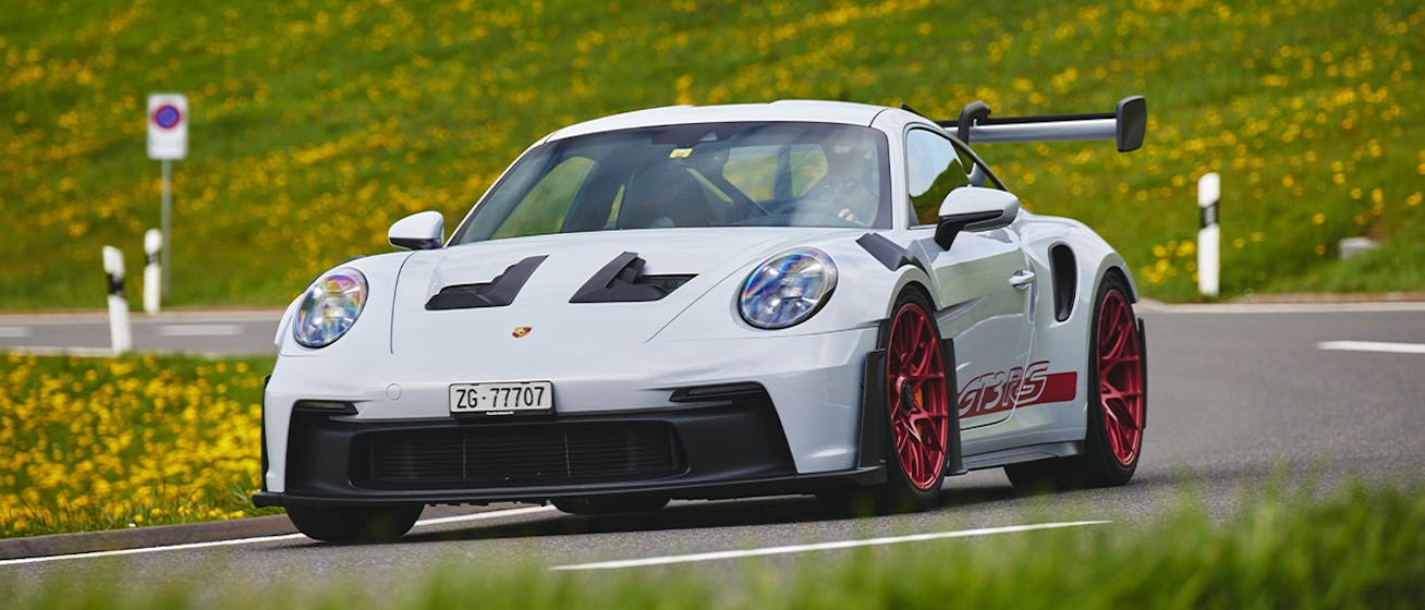 Porsche 911 GT3 RS driving on Swiss mountain road