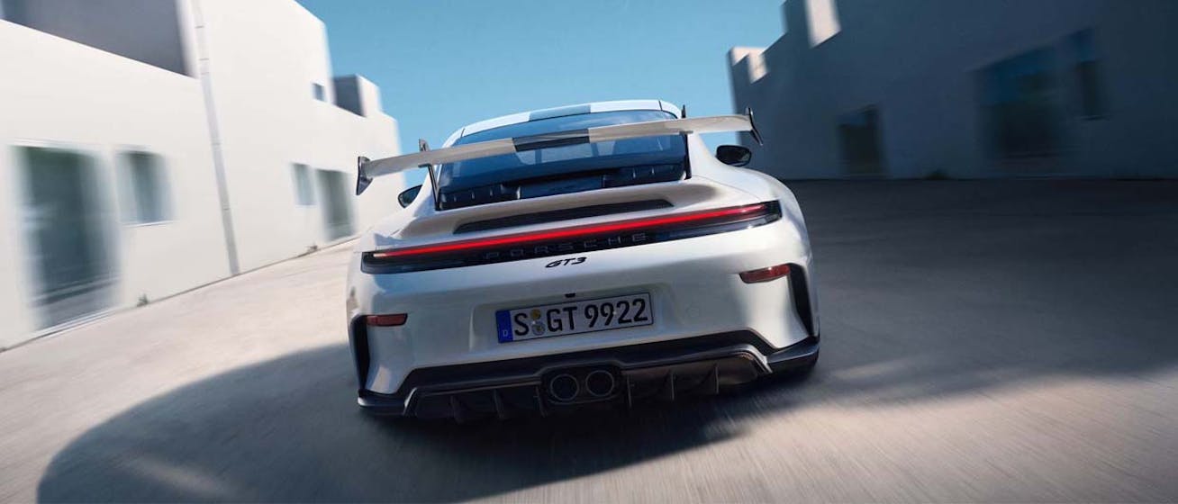 Rear view of Porsche 911 GT3 (type 992) driving 